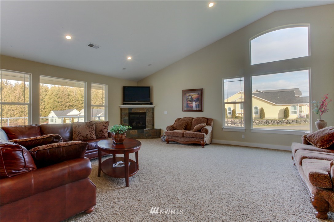 51 Pinehurst Loop Sequim, WA 98382 - Photo 19 of 24 a living room with furniture and a flat screen tv
