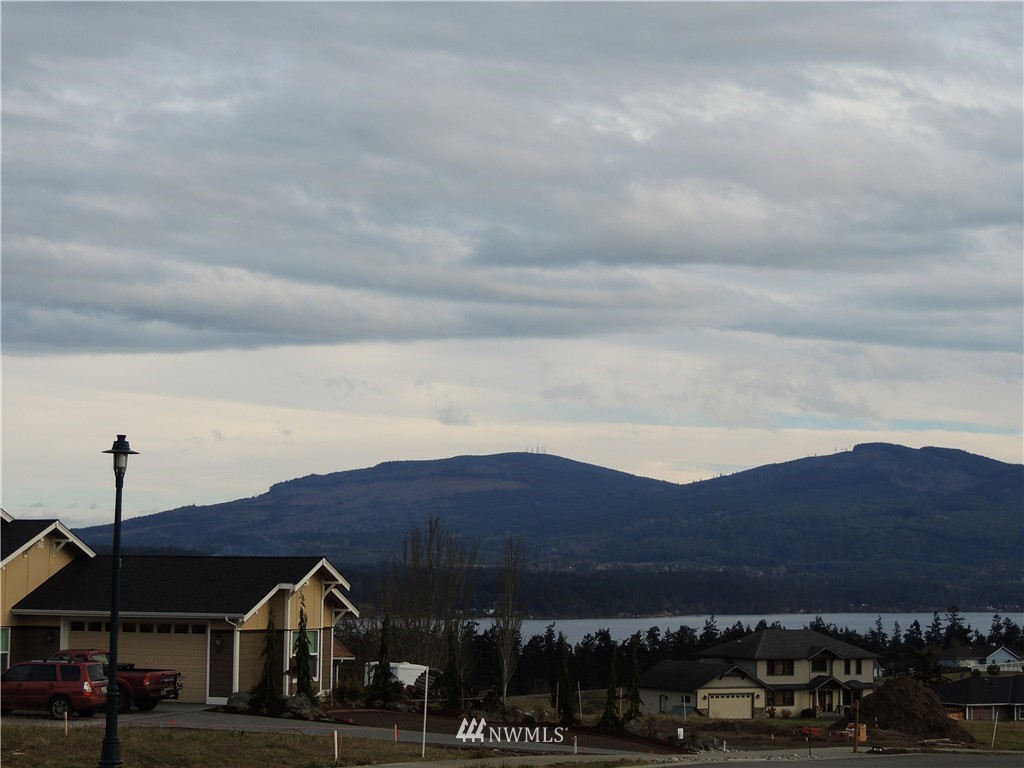 51 Pinehurst Loop Sequim, WA 98382 - Photo 23 of 24 a view of houses with a street