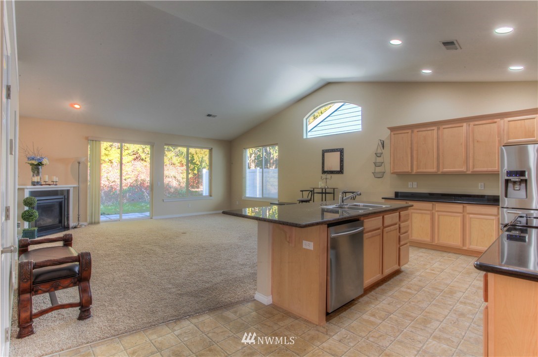 51 Pinehurst Loop Sequim, WA 98382 - Photo 6 of 24 a kitchen with granite countertop a stove and a sink