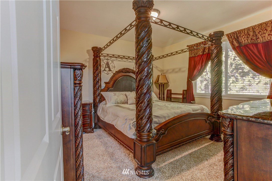 51 Pinehurst Loop Sequim, WA 98382 - Photo 8 of 24 a bedroom with a bed and a window