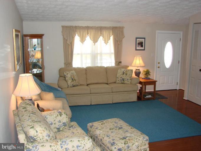 239 Sandhill Road Essex, MD 21221 - Photo 3 of 18 a living room with furniture and a large window