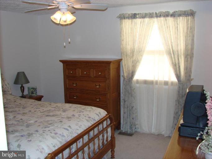 239 Sandhill Road Essex, MD 21221 - Photo 8 of 18 a bedroom with a bed and a window