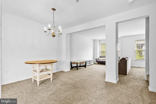 a view of a livingroom with furniture and a table