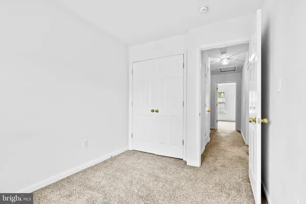 a view of a room with a hallway