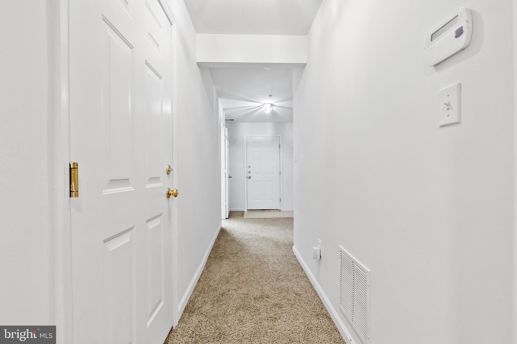 437-439 &445 Kenneth Square Baltimore, MD 21212 - Photo 25 of 40 a view of a hallway with white walls