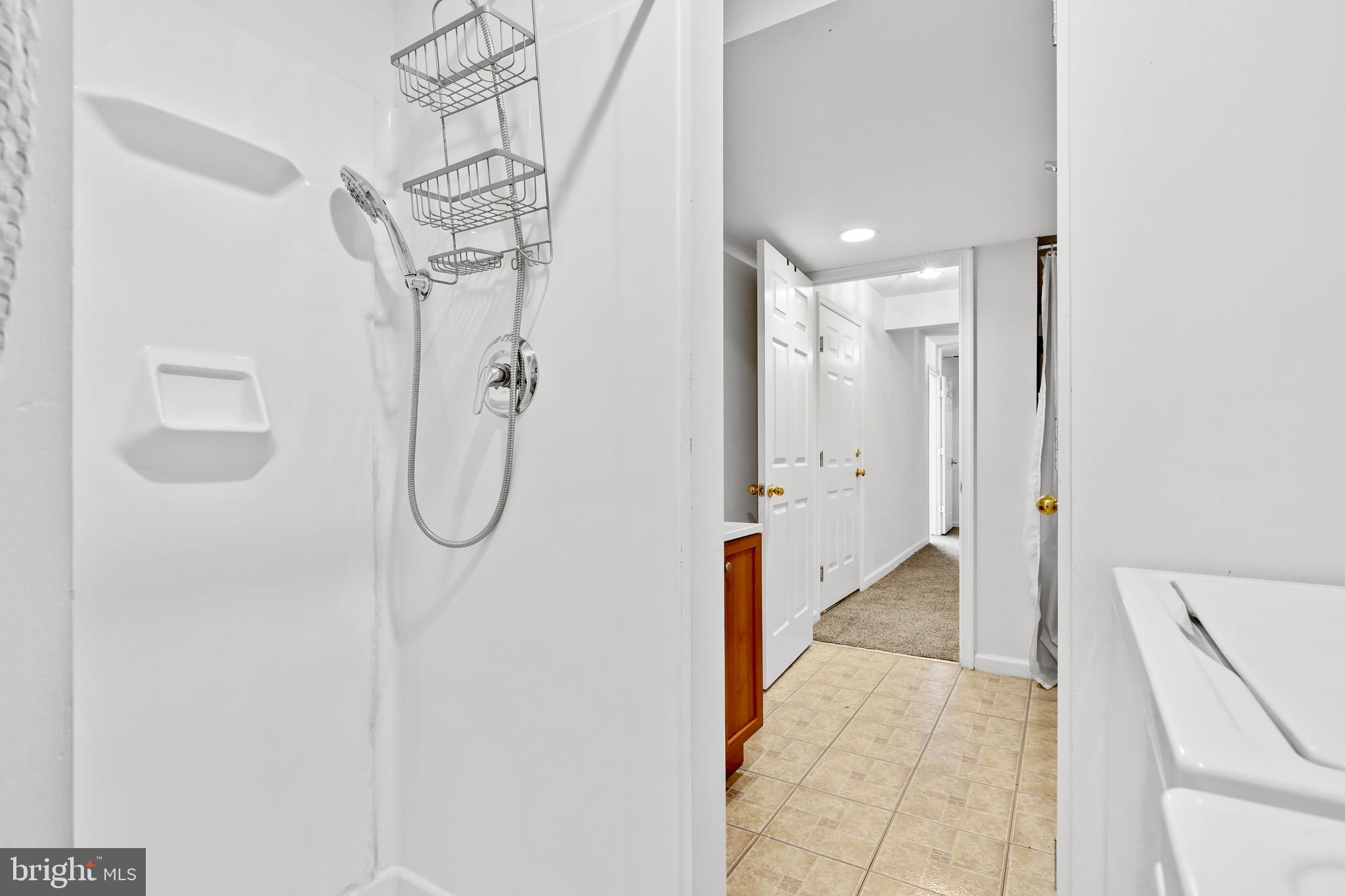 437-439 &445 Kenneth Square Baltimore, MD 21212 - Photo 31 of 40 a bathroom with a shower and a glass door