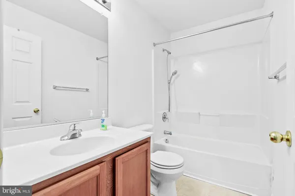 a bathroom with a sink a toilet and a bathtub