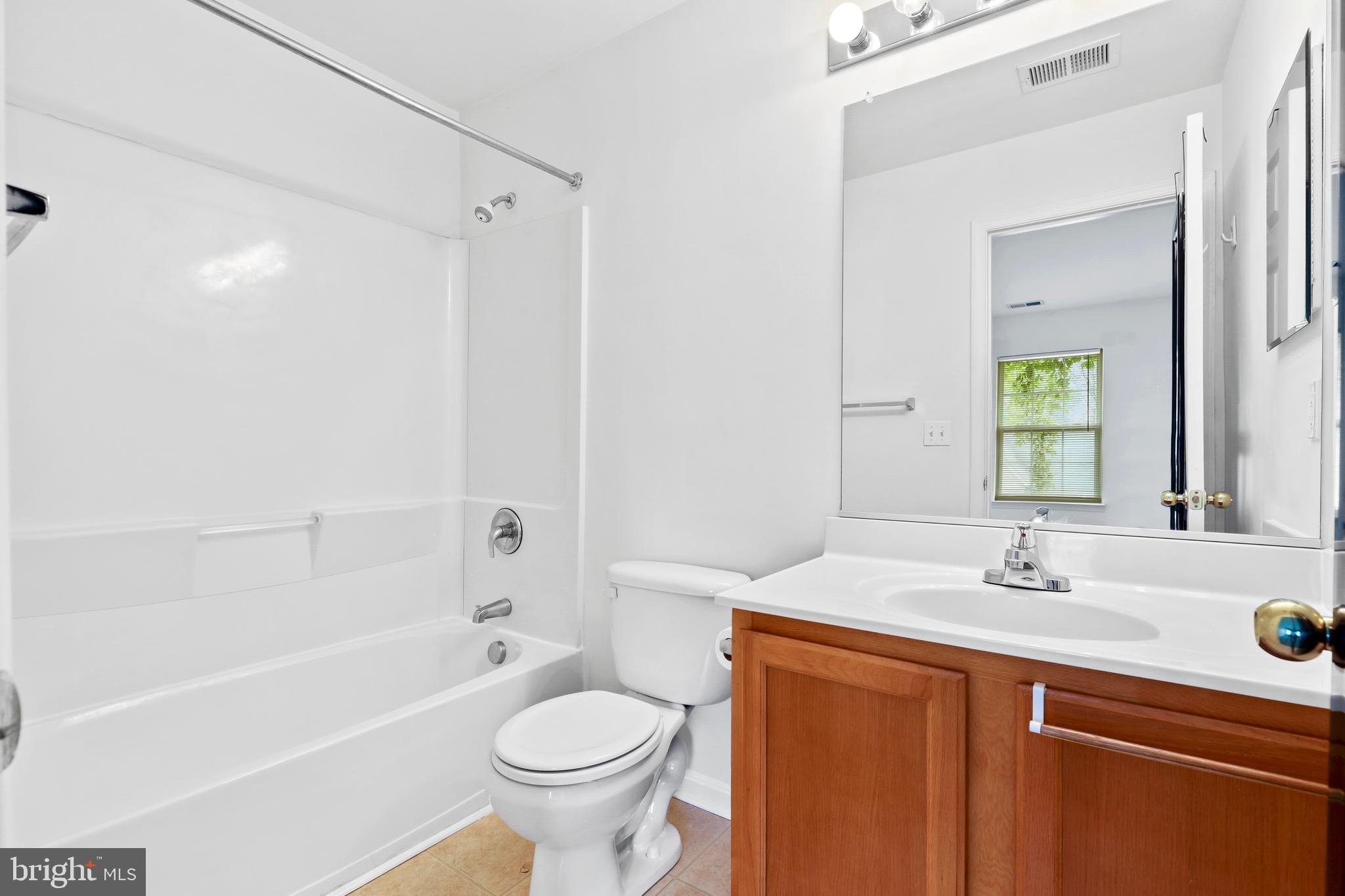 437-439 &445 Kenneth Square Baltimore, MD 21212 - Photo 33 of 40 a bathroom with a sink toilet and shower