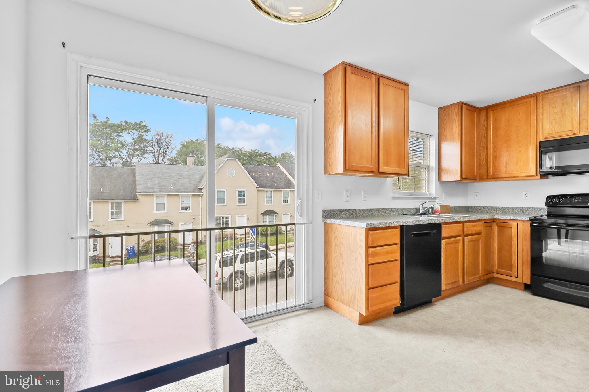 437-439 &445 Kenneth Square Baltimore, MD 21212 - Photo 8 of 40 a kitchen with stainless steel appliances granite countertop a stove a sink and a microwave