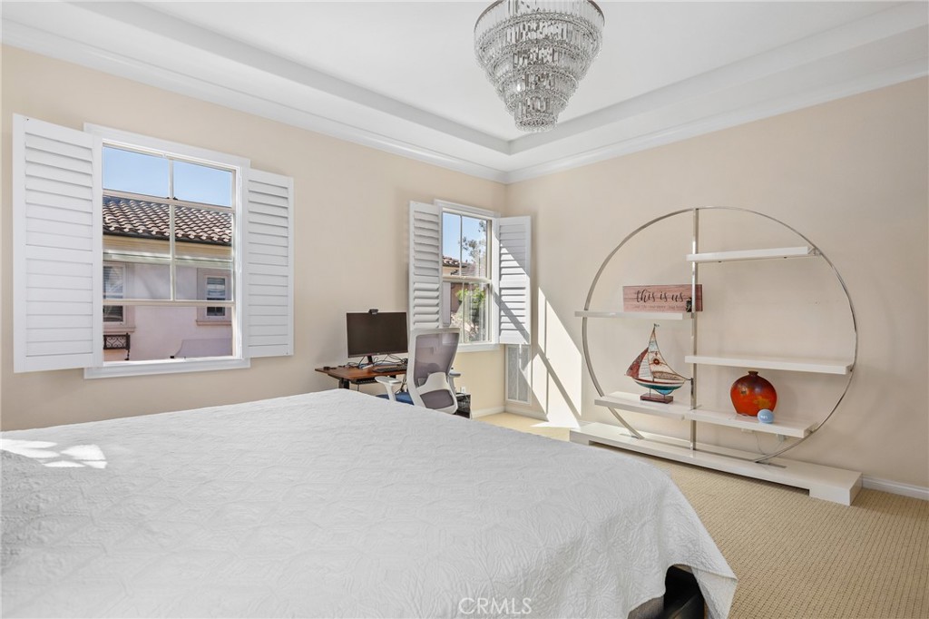 110 Blaze Irvine, CA 92618 - Photo 17 of 28 a bedroom with a bed and a large window