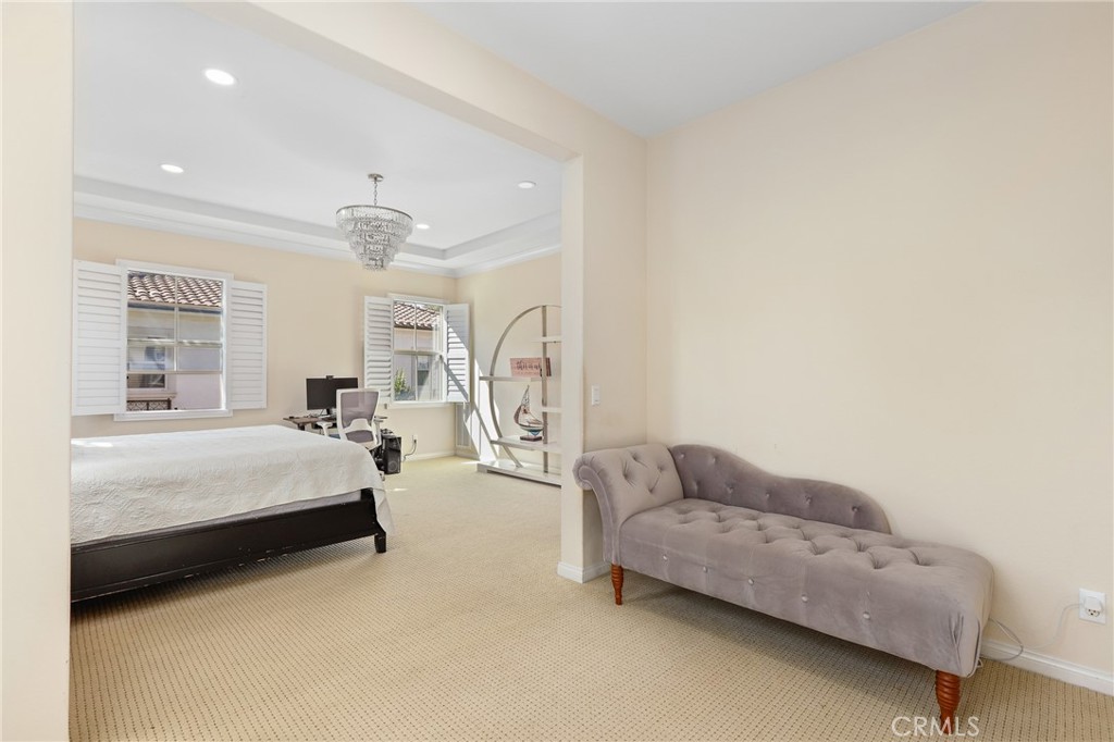 110 Blaze Irvine, CA 92618 - Photo 18 of 28 a spacious bedroom with a bed couch and window