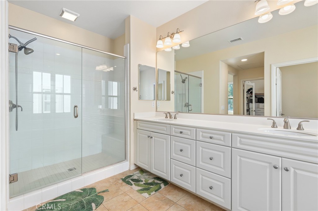 110 Blaze Irvine, CA 92618 - Photo 19 of 28 a spacious bathroom with double sink and shower