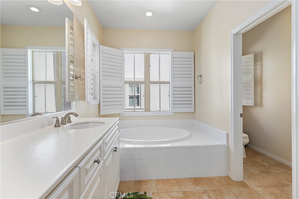 110 Blaze Irvine, CA 92618 - Photo 20 of 28 a bathroom with a bathtub and a sink