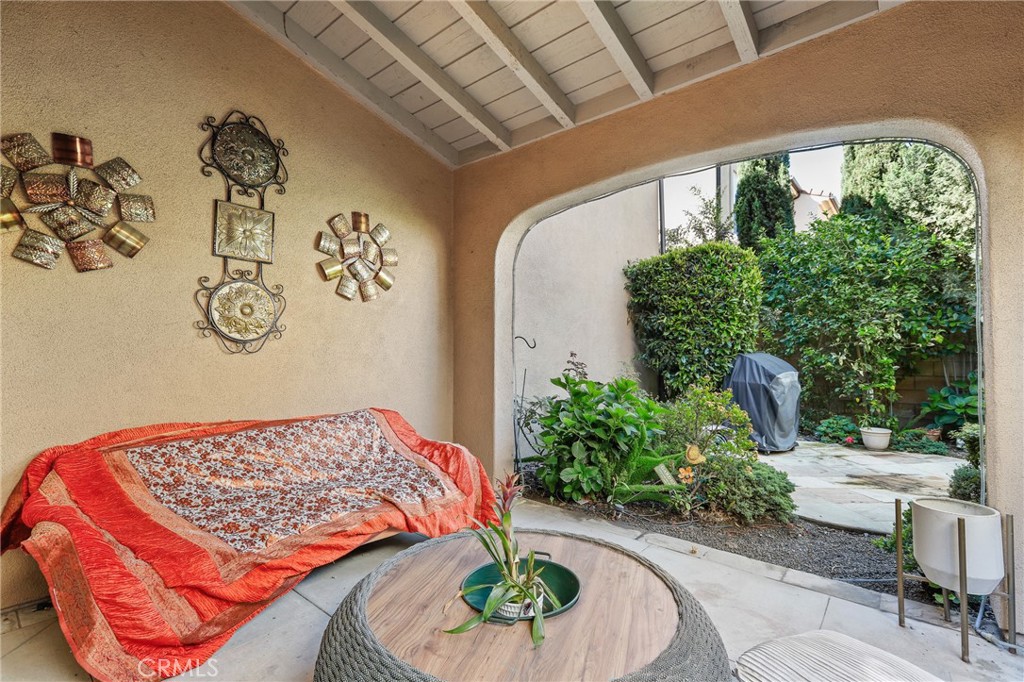 110 Blaze Irvine, CA 92618 - Photo 28 of 28 a bedroom with a bed and a table in it