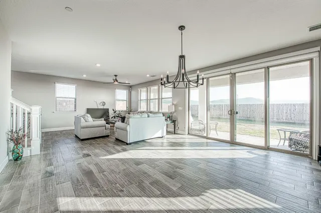 a kitchen with a sink appliances and cabinets