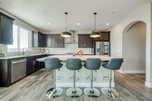 a kitchen with a sink cabinets and window