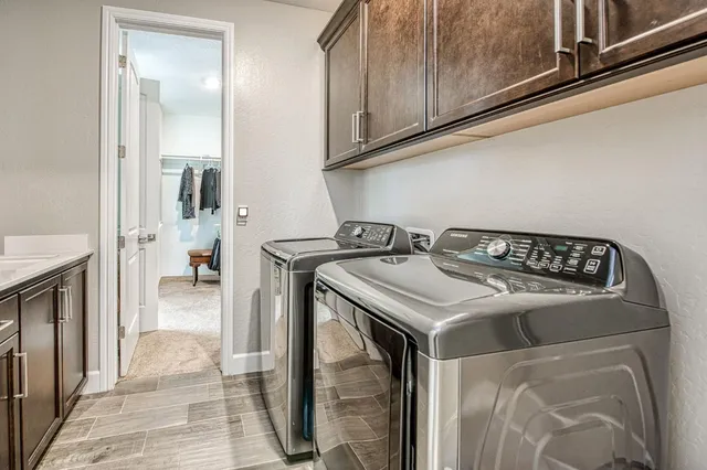 a spacious bedroom with a bed and a ceiling fan