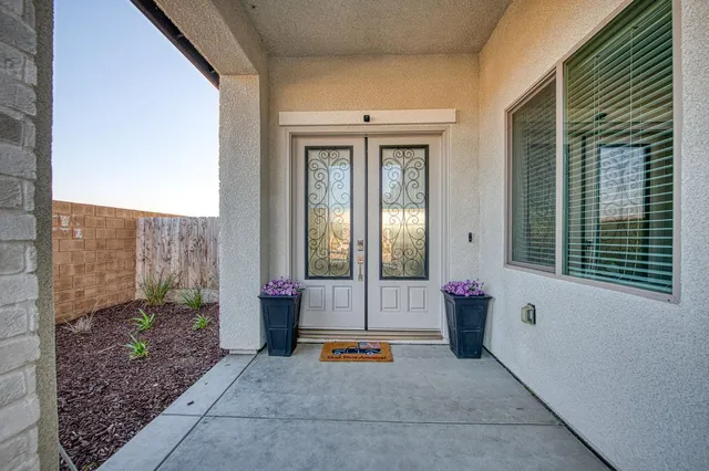 a backyard of a house with outdoor seating