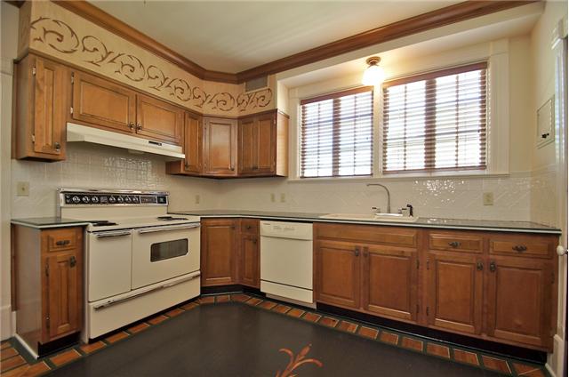 311 North Garner Street Springfield, TN 37172 - Photo 15 of 20 Kitchen has extra large stove, ceramic backsplash, custom painted wood floors and a large pantry