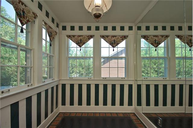 311 North Garner Street Springfield, TN 37172 - Photo 16 of 20 Sun/Breakfast room off kitchen. Lots of windows, painted floors, and a mirrored wall