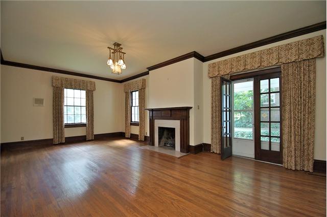 311 North Garner Street Springfield, TN 37172 - Photo 6 of 20 Large living room with beautiful old fireplace, french doors to side porch and hardwood floors