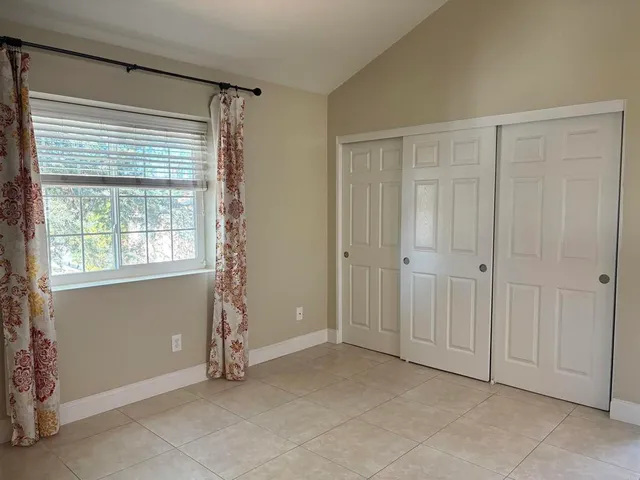 a view of a bathroom from a corridor