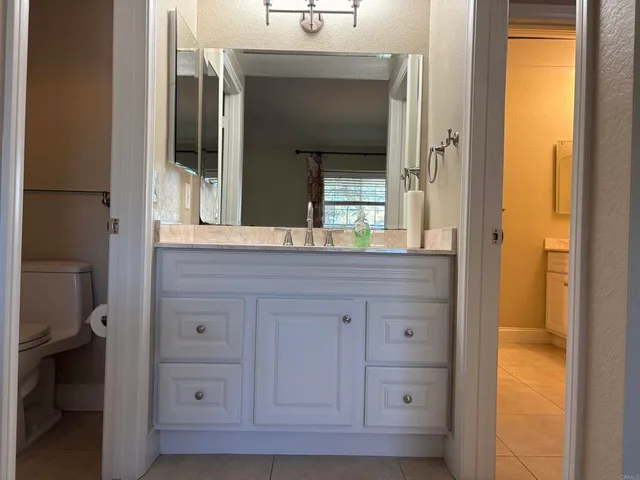 a bathroom with a shower and a sink