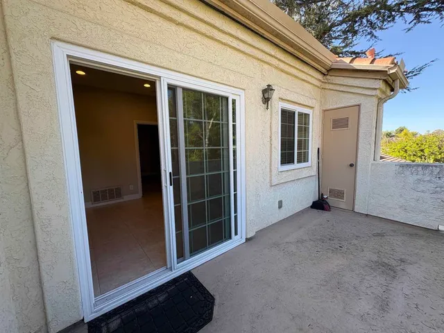 a view of a back yard of the house and green space