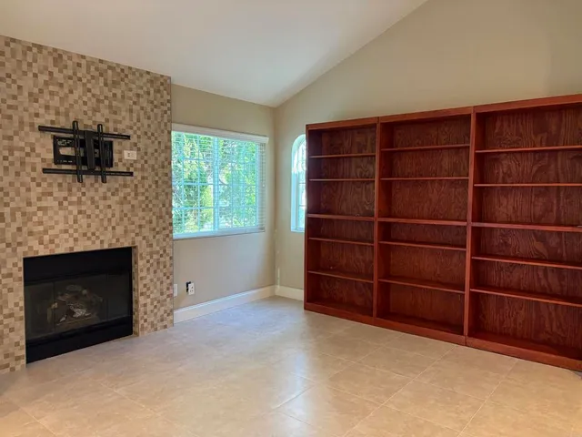 a view of an empty room with empty shelves