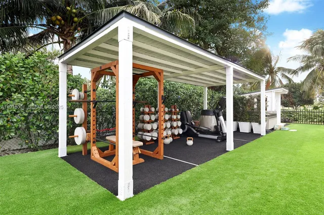 a view of a house with backyard and porch