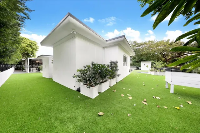 a view of a backyard with a garden and plants
