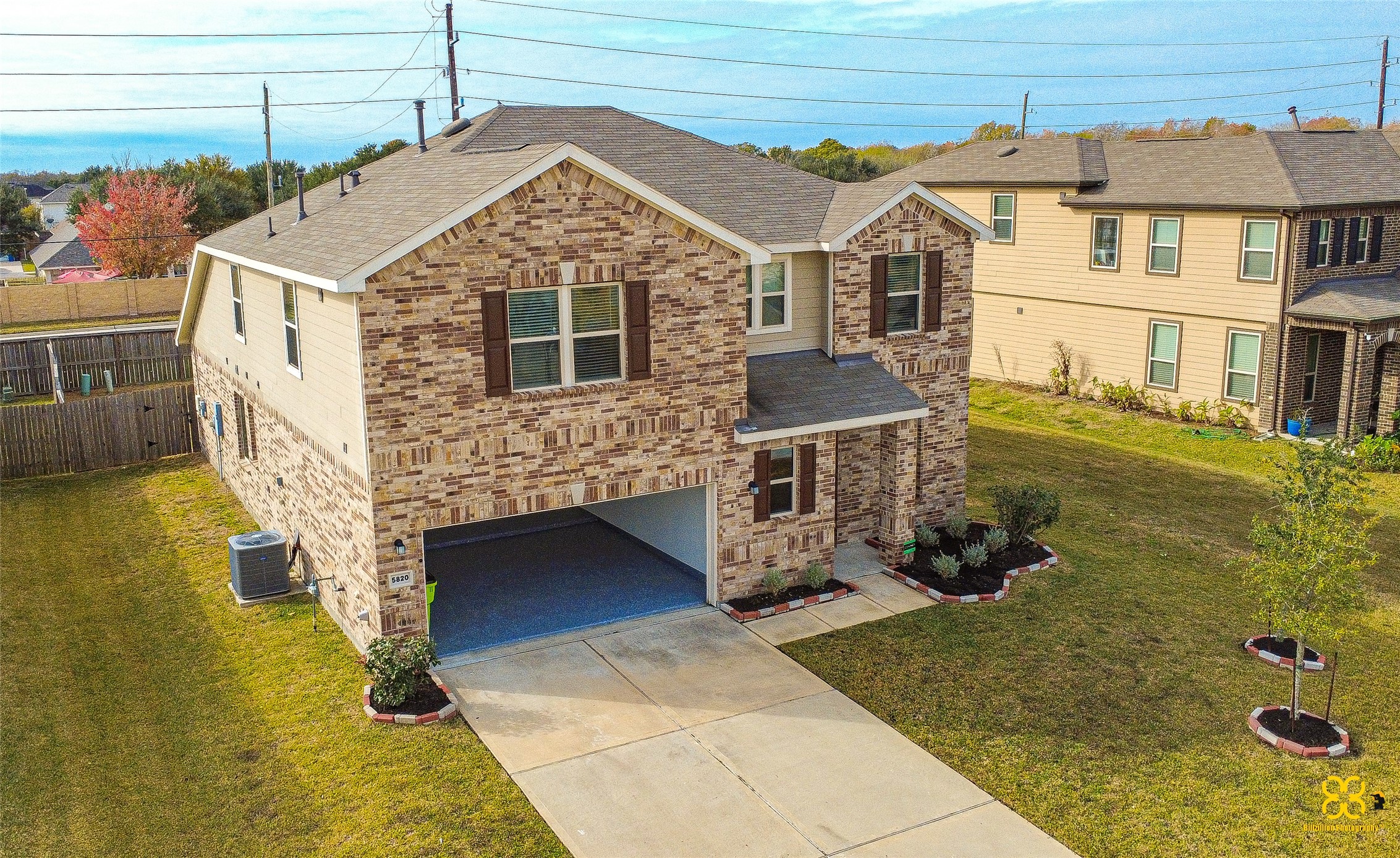 5820 Bluebonnet Lane Rosenberg, TX 77469 - Photo 5 of 43 This photo shows a two-story home with a neatly maintained front yard and driveway. The surrounding area is spacious with a fenced backyard, providing a sense of privacy.