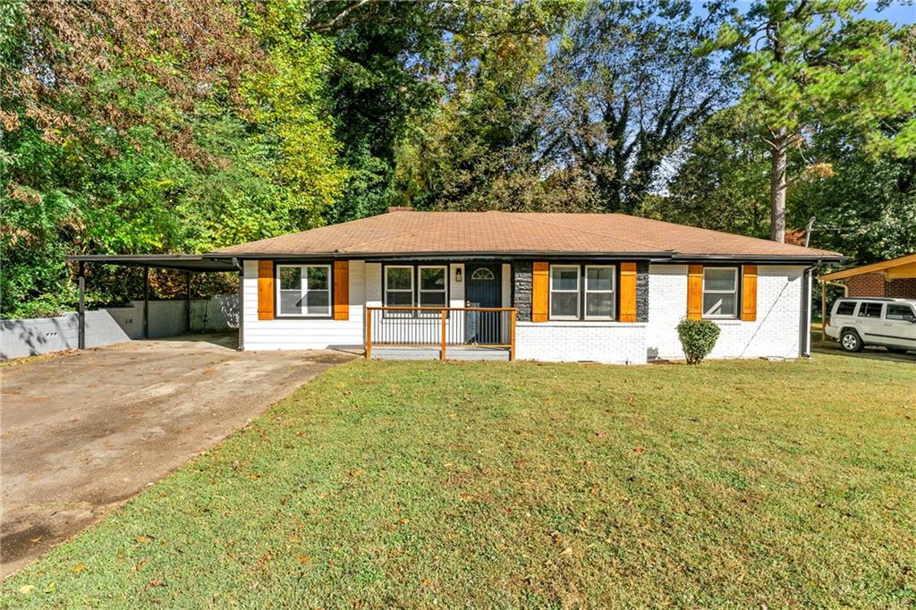 3028 Pasadena Drive Decatur, GA 30032 - Photo 1 of 1 a front view of a house with a garden