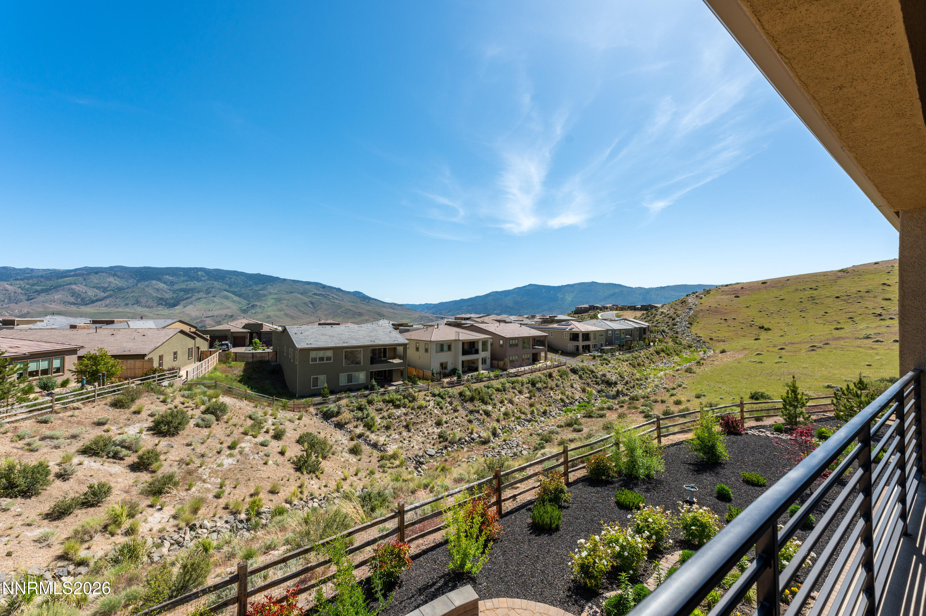 9028 Iron Sky Court Reno, NV 89523 - Photo 33 of 36 a view of a balcony with an ocean view