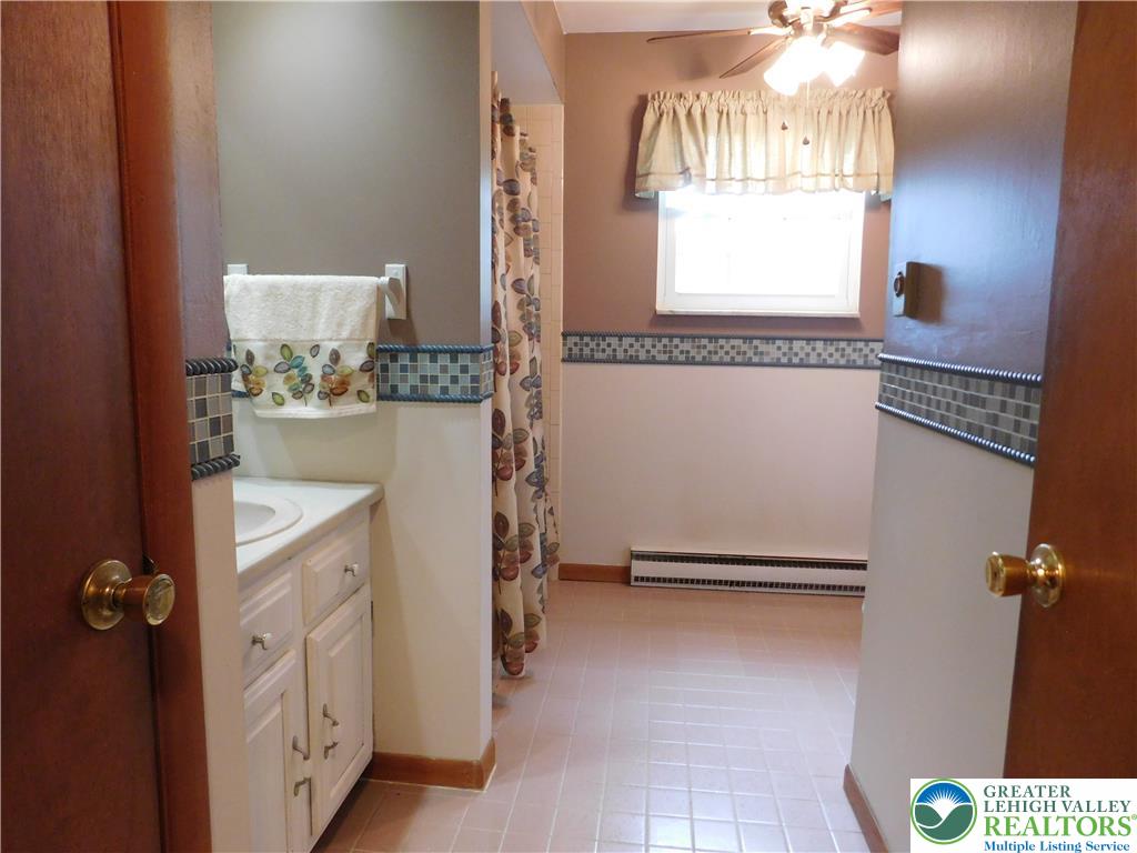 21 Will Barnesville, PA 18214 - Photo 16 of 23 A well-lit bathroom, featuring a vanity and window, creates a functional space.