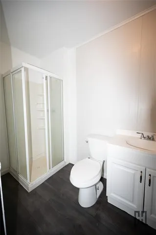 a bathroom with a toilet and a sink