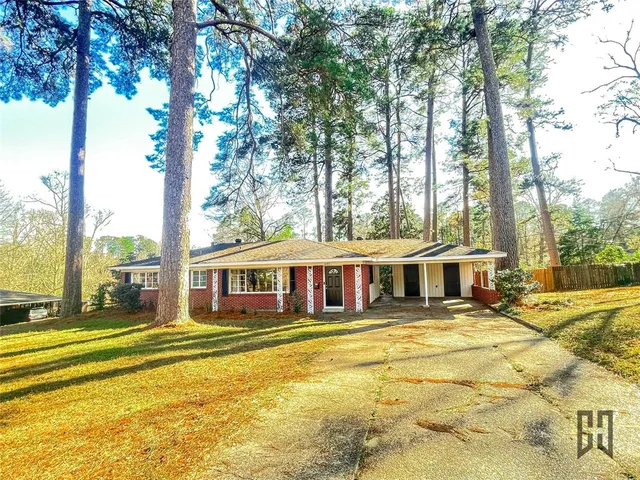 a view of a swimming pool with outdoor seating