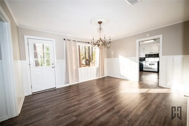 a view of a livingroom with wooden floor