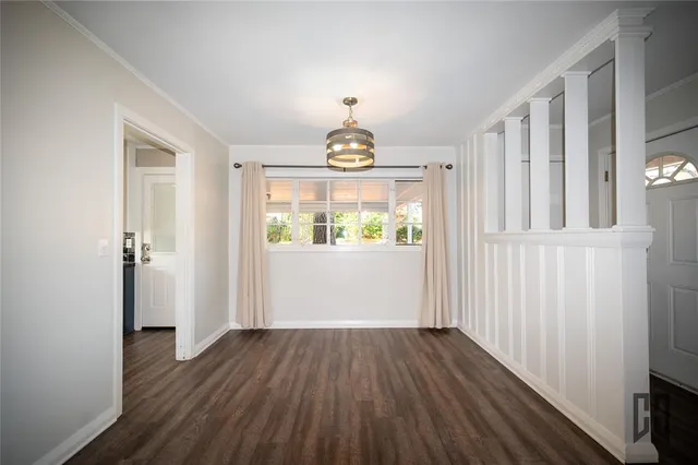 a view of entryway with wooden floor