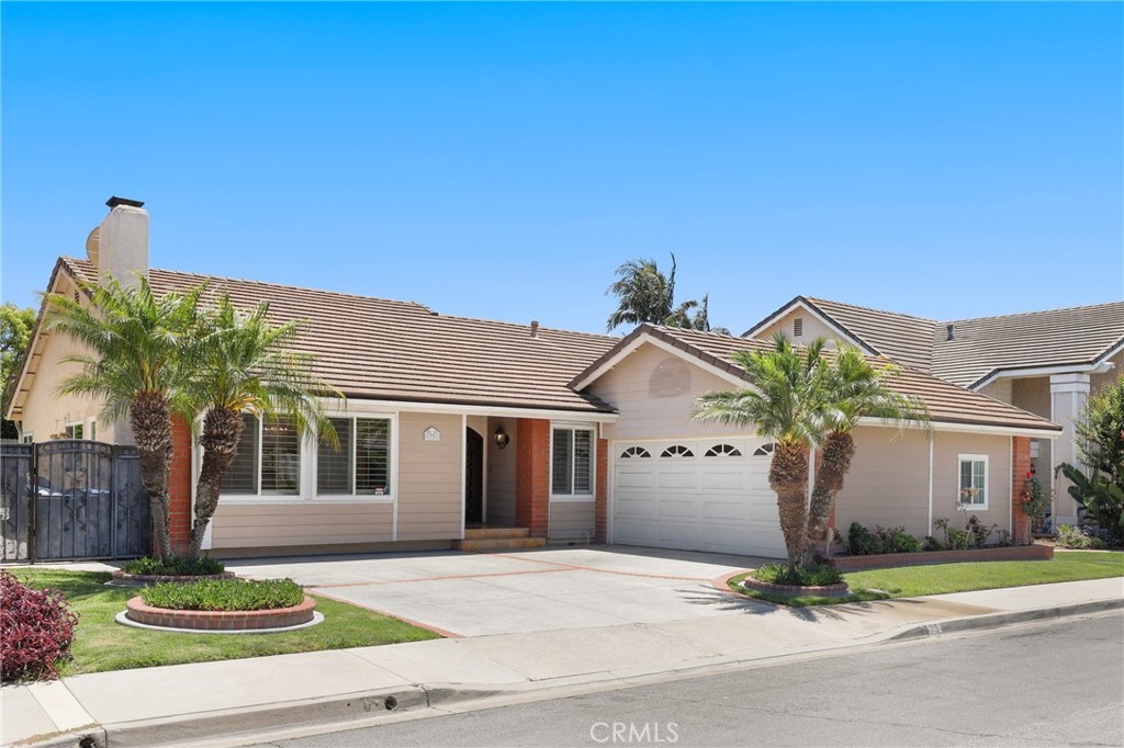 39 Foxhill Irvine, CA 92604 - Photo 1 of 1 a view of a white house with large windows next to a road