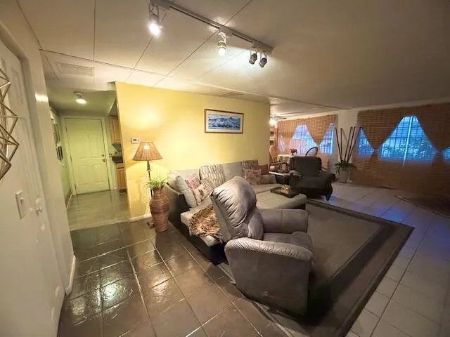 a living room with furniture and a rug