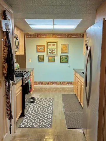 a bathroom with a granite countertop sink a washer and dryer