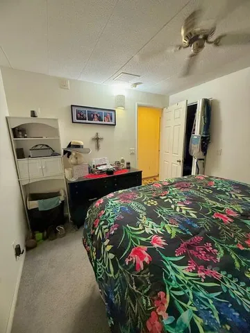 a bedroom that has a bed and a closet