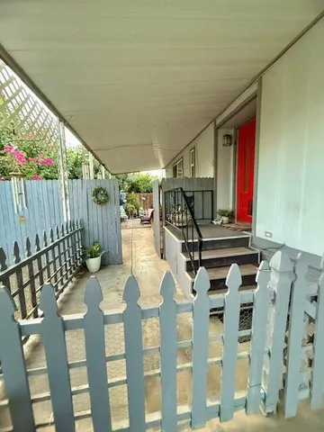 a view of a chairs and table in the balcony