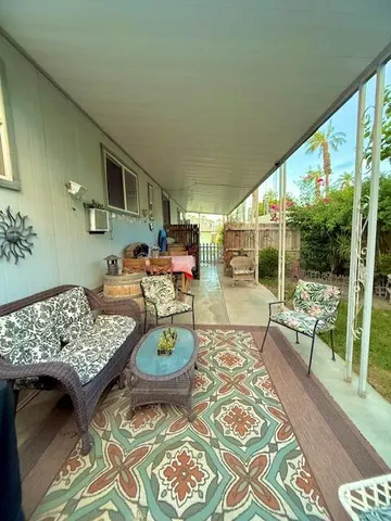 a outdoor living space with furniture and a garden