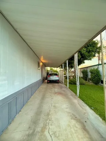 a view of house with backyard