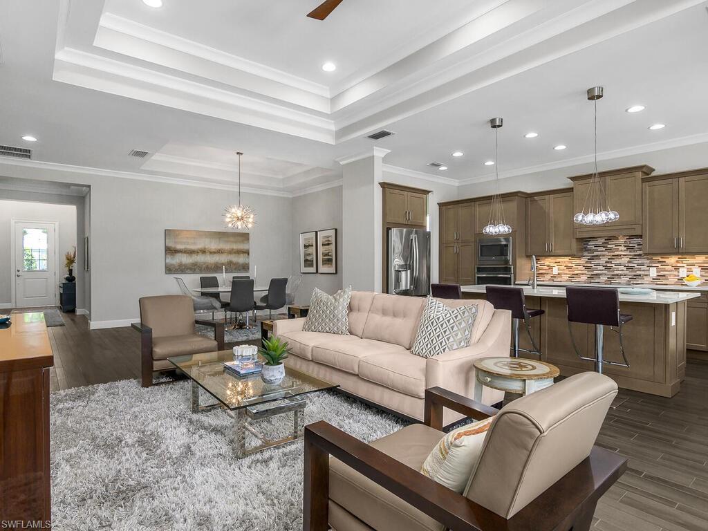 6478 Warwick Avenue Naples, FL 34113 - Photo 12 of 47 a living room with furniture and kitchen view