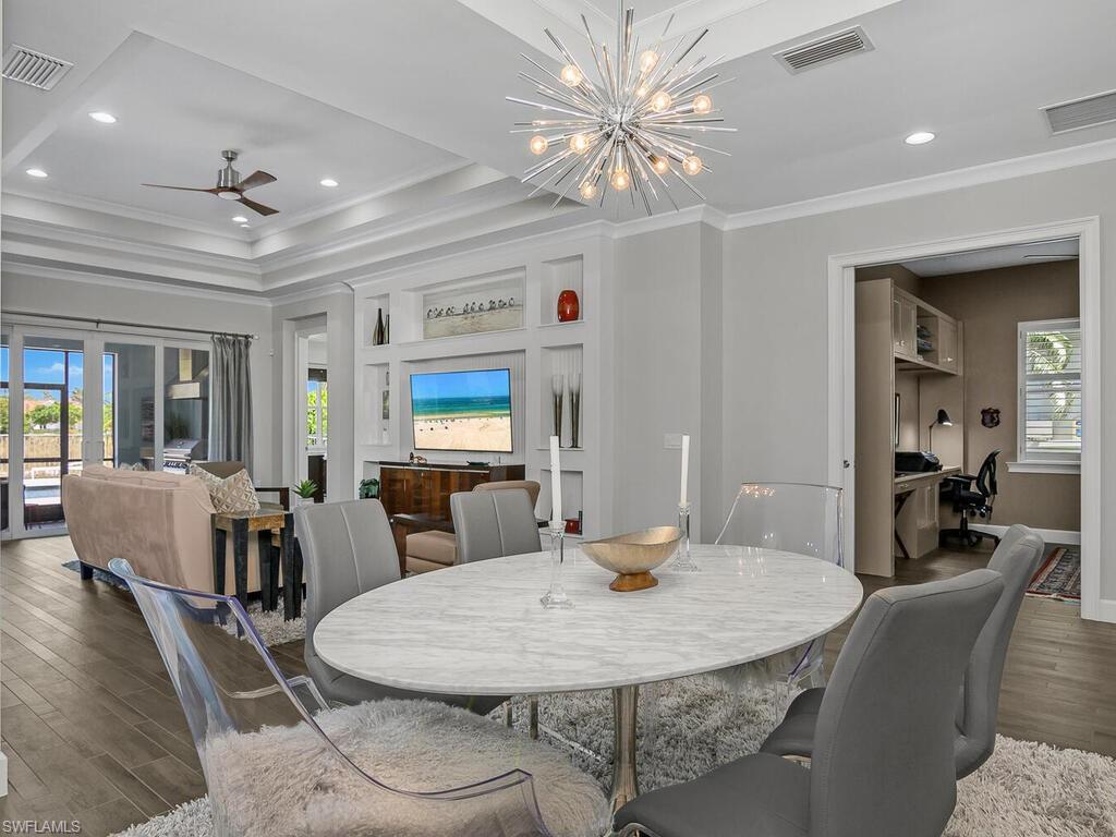 6478 Warwick Avenue Naples, FL 34113 - Photo 17 of 47 a view of a dining room with furniture