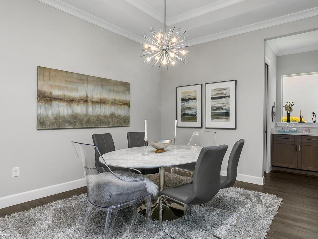 6478 Warwick Avenue Naples, FL 34113 - Photo 18 of 47 a view of a dining room with furniture