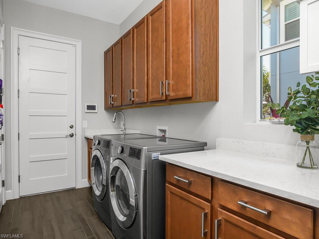6478 Warwick Avenue Naples, FL 34113 - Photo 25 of 47 a utility room with dryer and washer